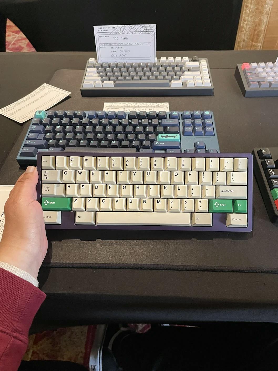 A 60%, winkey-less purple mechanical keyboard with beige keycaps